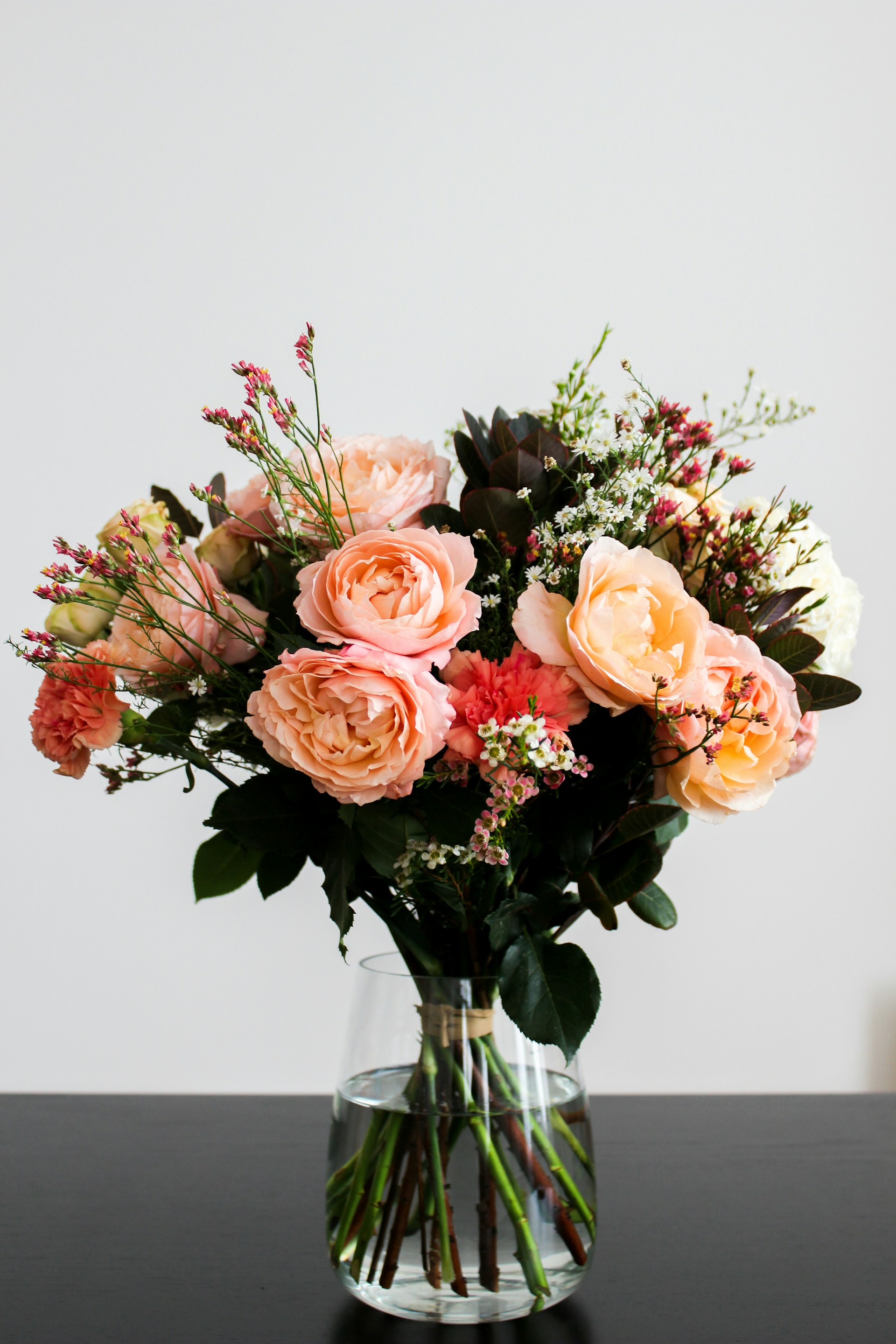 Elegant peach rose arrangement in vase